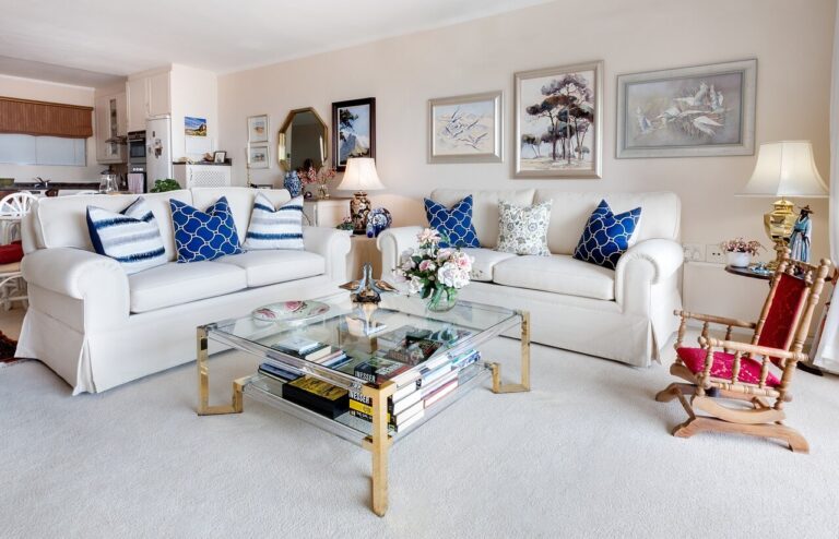 Top 5 tips for selling a home decluttered living room with sofas , table and armchairs
