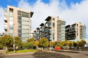 301 The Cubes Beacon South Quarter Sandyford, Dublin 18 front view of the apartment block with various others adjacent and a street view with paths and trees