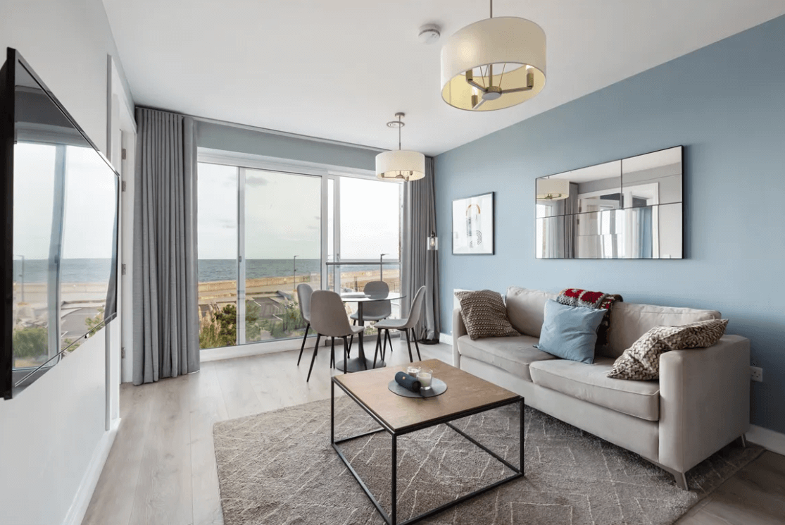 59 Campion Marina Village Greystones living room view with sofa, table and glass sliding doors to balcony area
