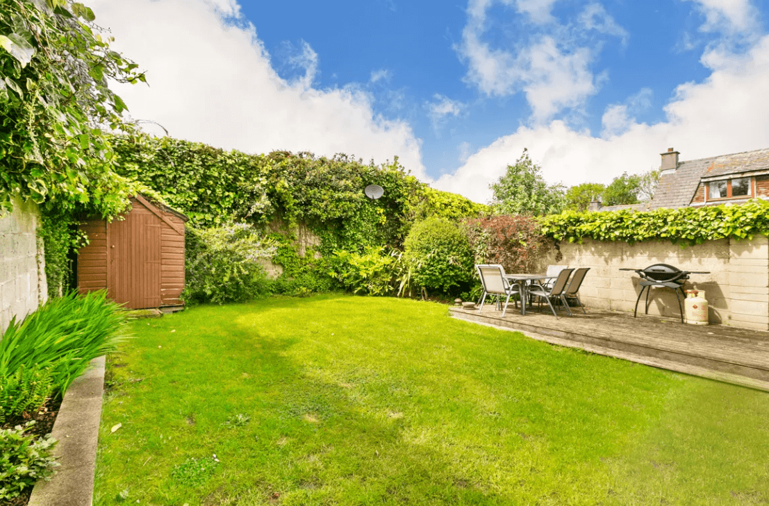 129 Wesbury Stillorgan Dublin Rear garden with large lawn, tool shed and table with chairs