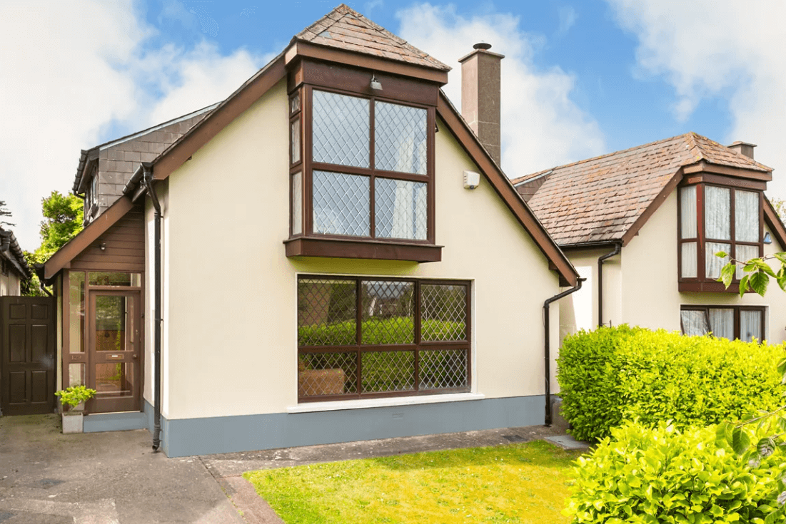 129 Wesbury Stillorgan Dublin Front view of the house with the garden, bushes, large bay window of main bedroom and large with of living room