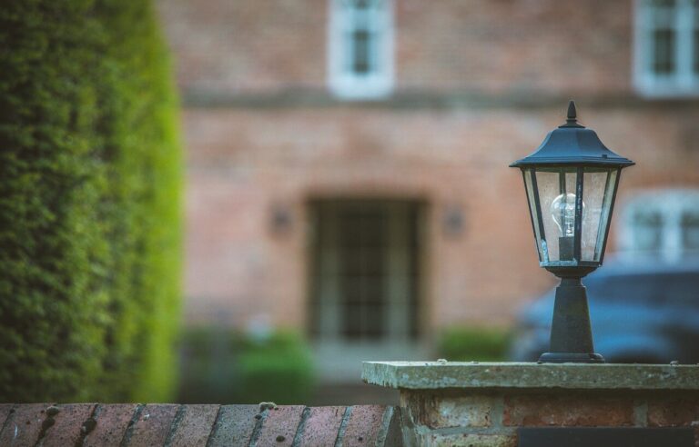 Acquisitions services George and Maguire properties old courtyard of house with fountain and light in foreground