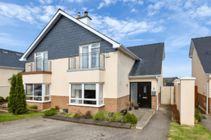 9 Sea Haven Wicklow Town George and Maguire Properties Front View of property with driveway, side entrance to rear of property and neighbouring houses