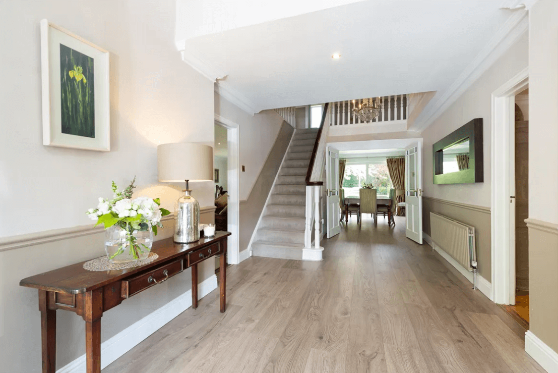 Balfour Ferndale Road Rathmichael Dublin George and Maguire Properties entrance hallway with timber flooring and white stairway with door to dining room