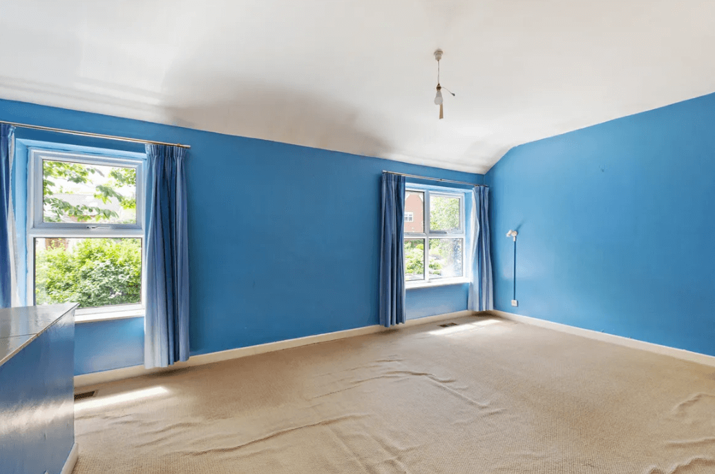 87 Shanganagh Vale Cabinteely Dublin George and Maguire Properties principal bedroom with blue walls and two windows